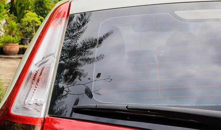 Back view of red car window for sticker